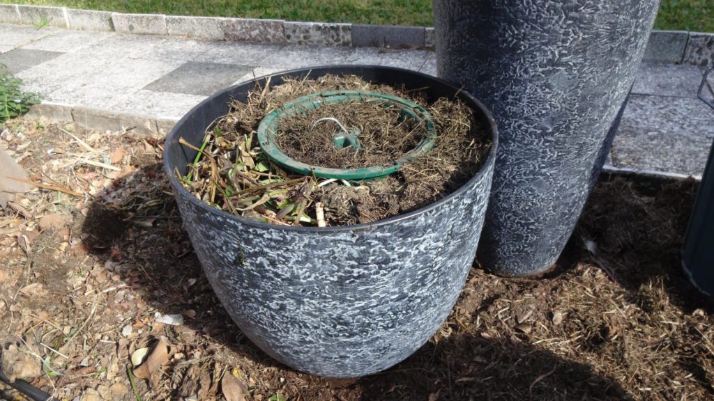 eco-eze Compot inside a planter pot for fast easy composting